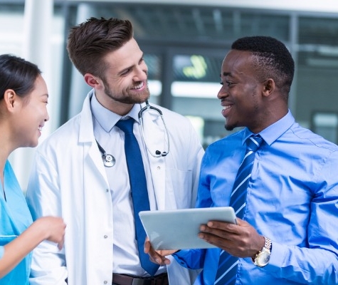 Image of informal meeting of doctors and business man