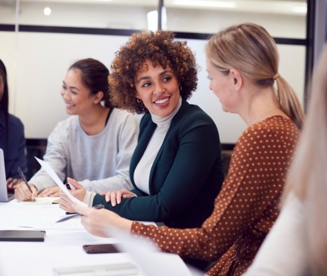 Image of business women discussing in a meeting