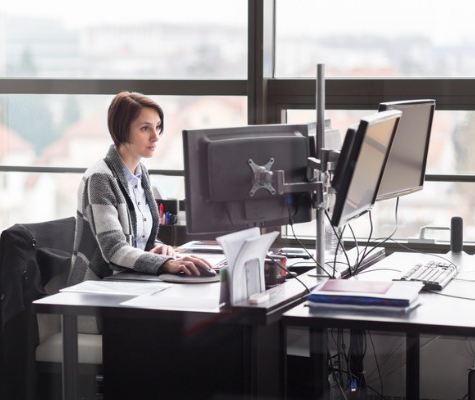 Image of business woman working at her work desk