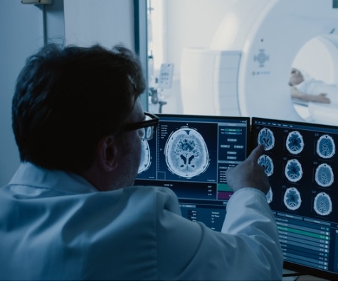 Image of doctor looking at MRI scans