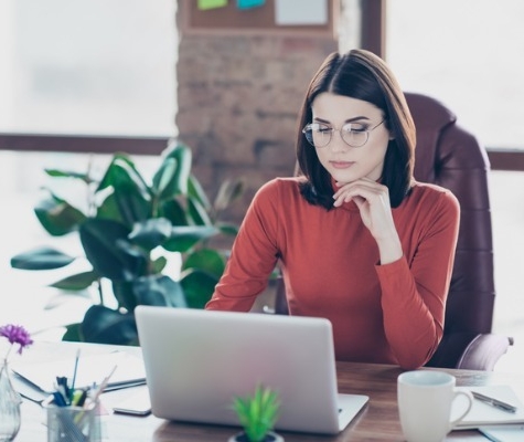 Image of business woman working at laptop