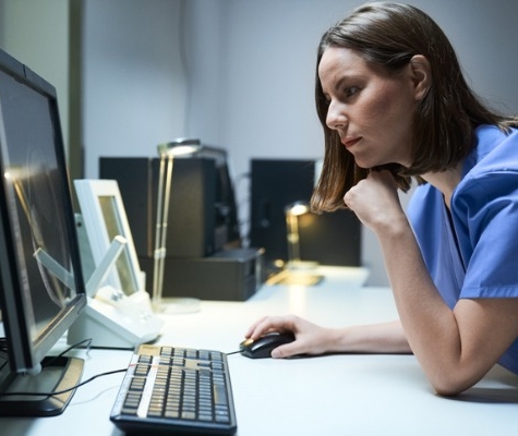 Image of Female Healthcare worker looking at computer screen